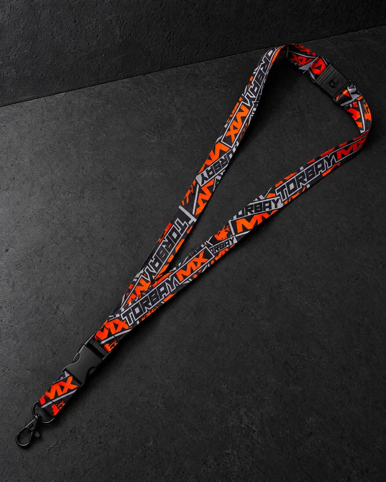 printed lanyards on a charcoal studio surface — Projectprint