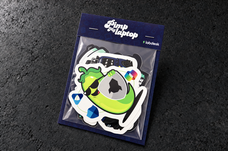 Angled landscape studio view of the Labdesk Premium sticker pack showing the navy printed backboard, folded header and clear bag.