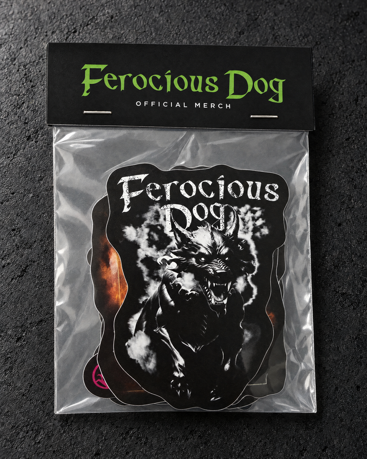 Portrait studio detail of a Ferocious Dog Budget sticker pack with its short top header card and clear sleeve.