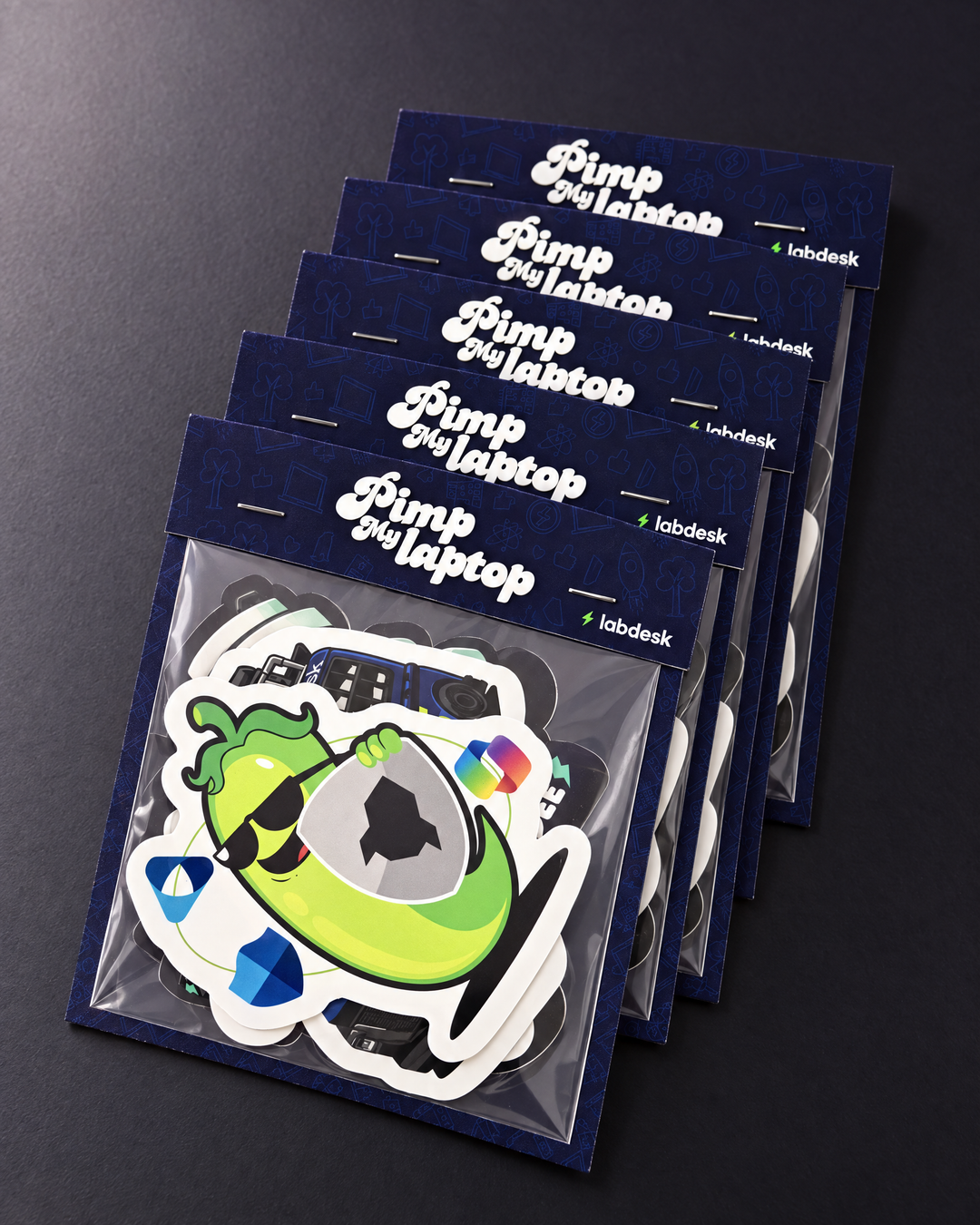 A stack of Labdesk Premium sticker packs with full patterned backing boards and wrap-over headers.