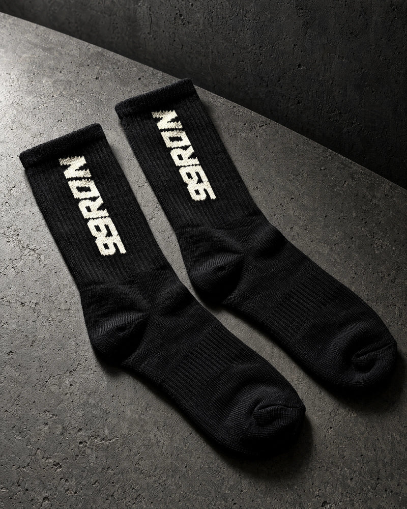 terry socks on a charcoal studio surface — Projectprint