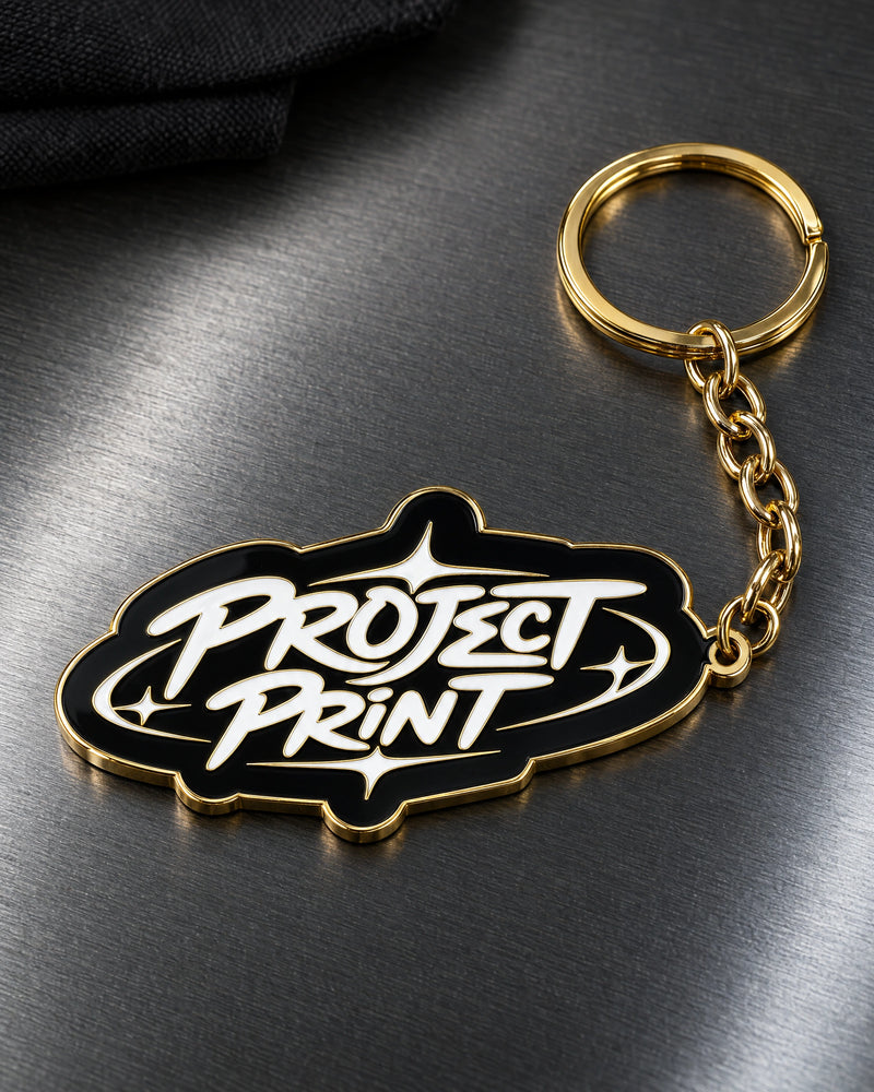 Project Print custom metal enamel keyring design in shiny gold, with matching chain and split ring.