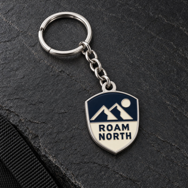 Roam North custom metal enamel keyring design in matt silver, with matching chain and split ring.