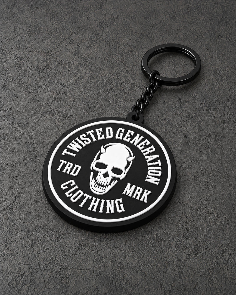 twisted generation skull keyring on a charcoal studio surface — Projectprint