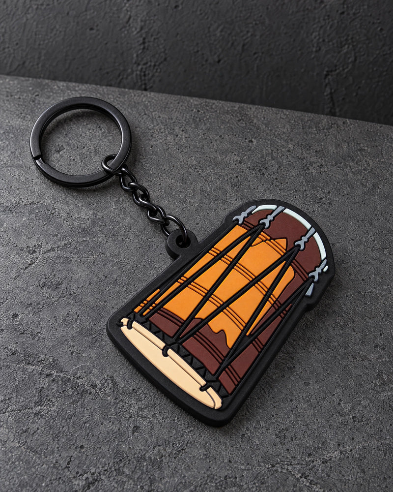 custom soft pvc keyrings on a charcoal studio surface — Projectprint