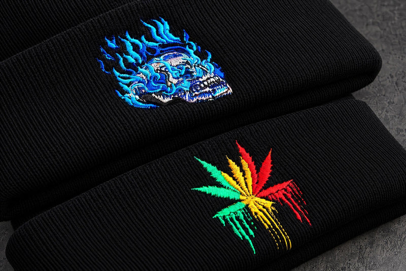 blue flame leaf embroidery detail on a charcoal studio surface — Projectprint
