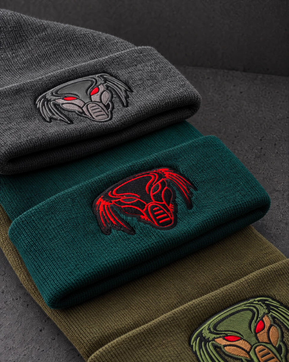 embroidered emblem colourways detail on a charcoal studio surface — Projectprint