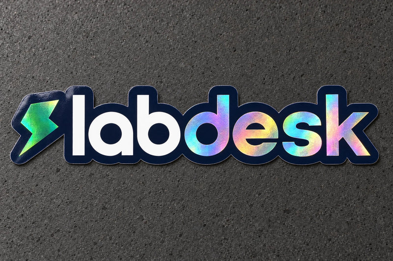 Projectprint holographic die cut sticker — labdesk wordmark, studio product view