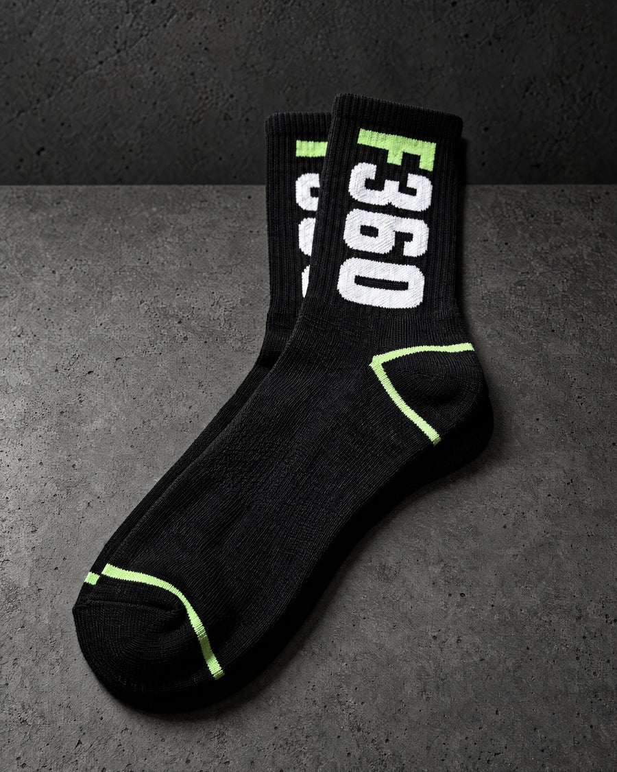 jacquard knit socks on a charcoal studio surface — Projectprint