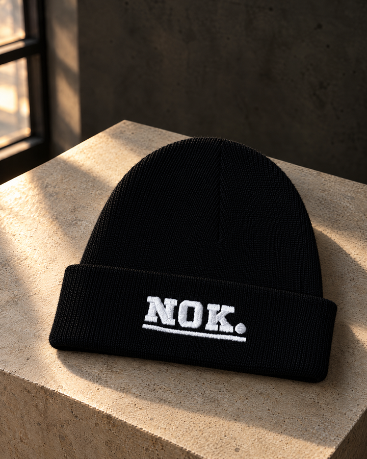 NOK. custom black ribbed cuffed beanie with white embroidered lettering — Project Print customer work, view 1
