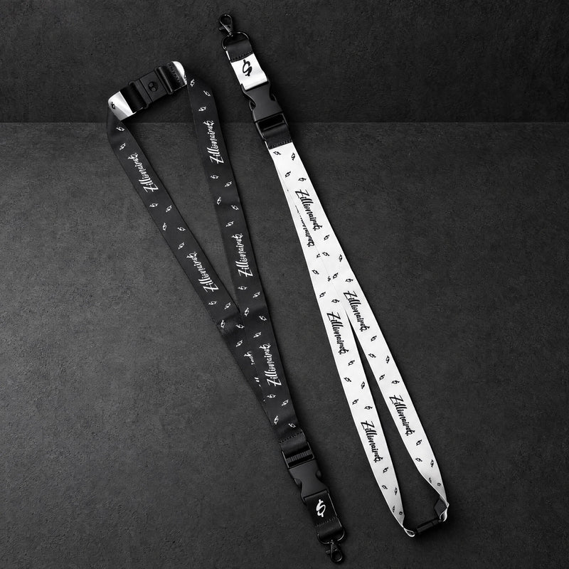 zillionaire printed lanyard pair on a charcoal studio surface — Projectprint