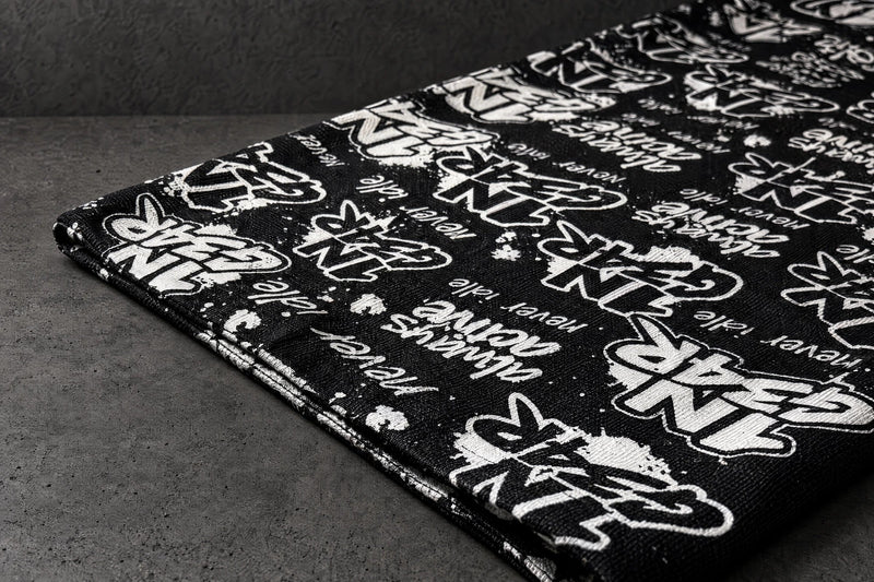 1ngear fabric edge print detail on a charcoal studio surface — Projectprint