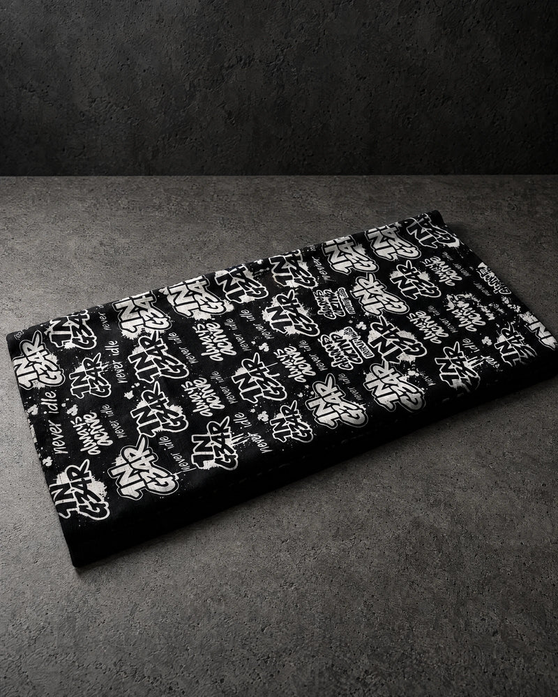1ngear folded snood on a charcoal studio surface — Projectprint