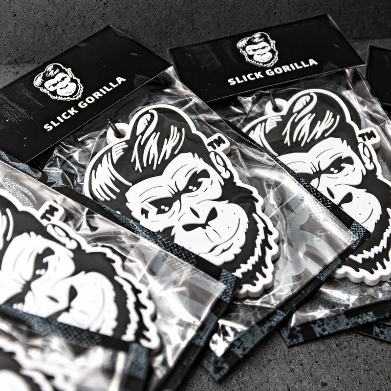 custom soft pvc keyrings on a charcoal studio surface — Projectprint