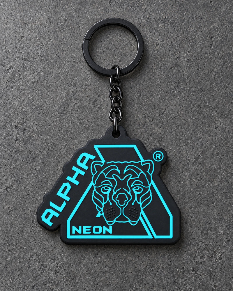 Projectprint custom soft PVC keyring — alpha neon, charcoal studio product photograph