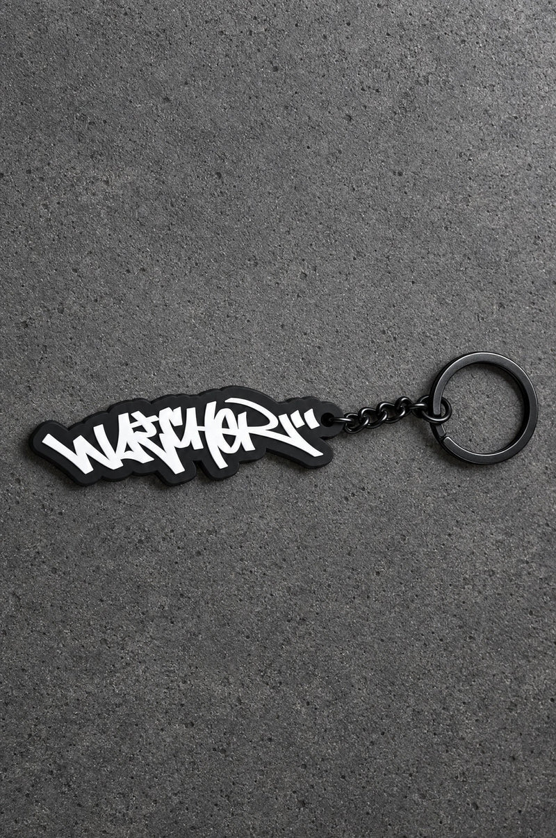 Projectprint custom soft PVC keyring — graffiti wordmark, charcoal studio product photograph
