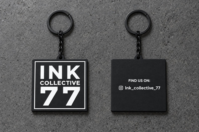 Projectprint custom soft PVC keyring — ink collective 77 front back, charcoal studio product photograph