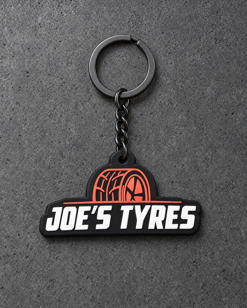 Projectprint custom soft PVC keyring — joes tyres, charcoal studio product photograph