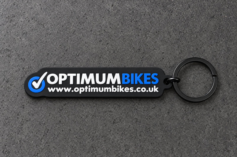 Projectprint custom soft PVC keyring — optimum bikes, charcoal studio product photograph