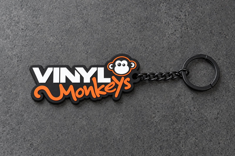 Projectprint custom soft PVC keyring — vinyl monkeys, charcoal studio product photograph