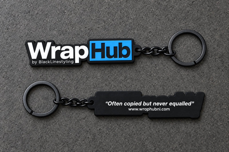 Projectprint custom soft PVC keyring — wraphub front back, charcoal studio product photograph