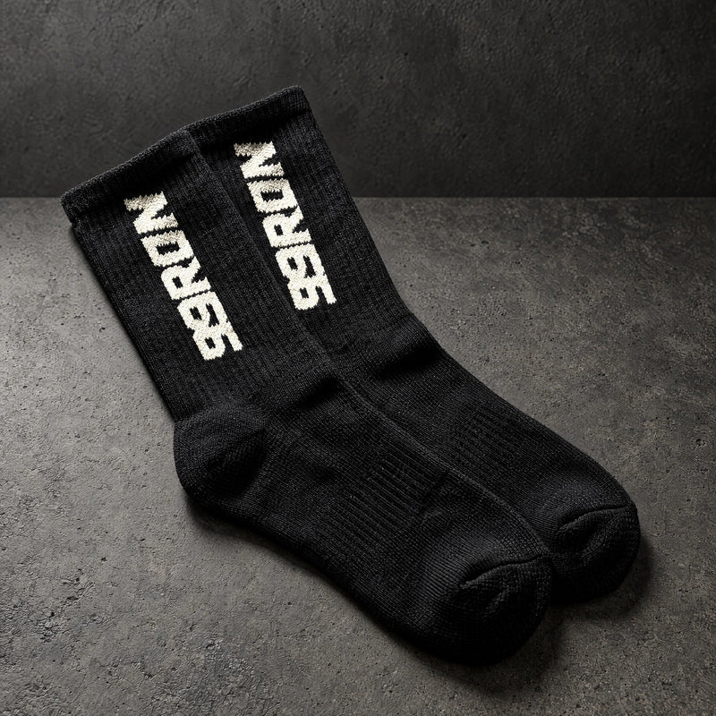 99ron black pair on a charcoal studio surface — Projectprint