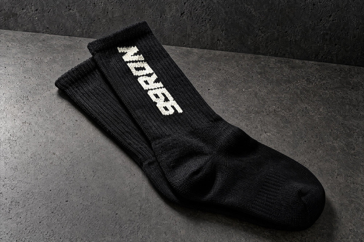 99ron black stacked pair on a charcoal studio surface — Projectprint