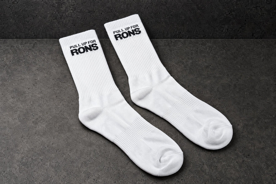pull up for rons white pair angle on a charcoal studio surface — Projectprint