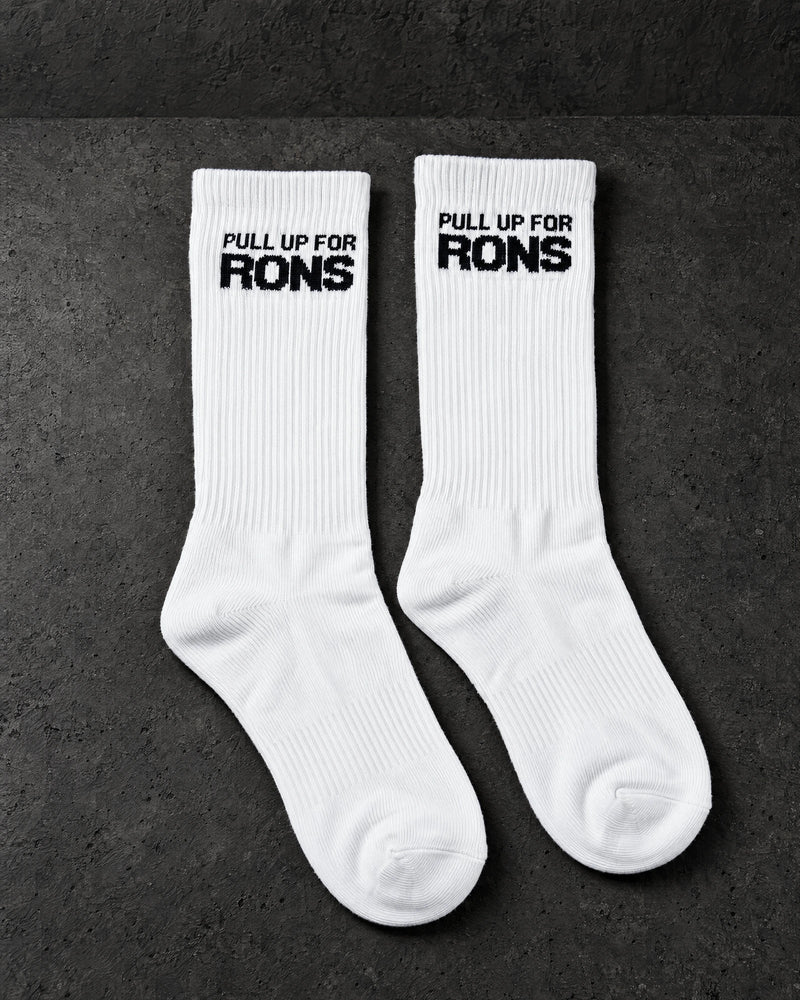 pull up for rons white pair on a charcoal studio surface — Projectprint