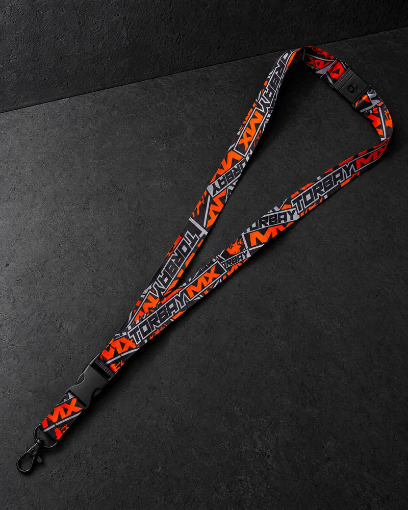 printed lanyards on a charcoal studio surface — Projectprint