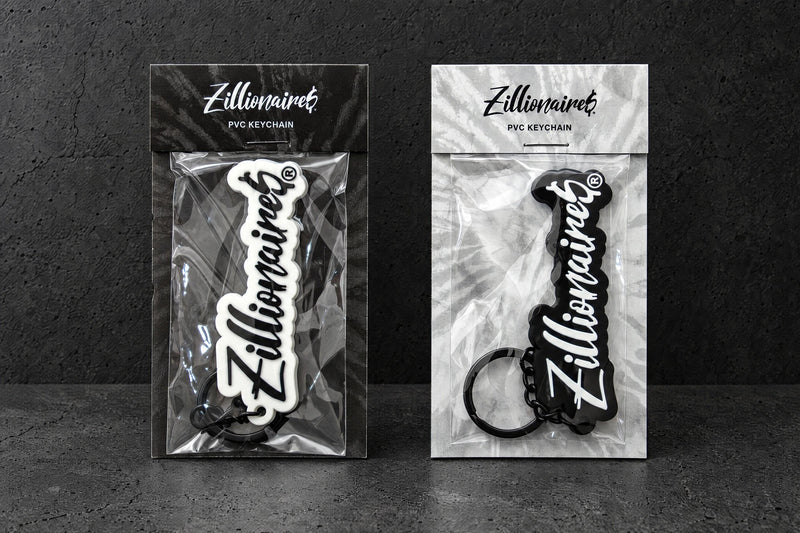 custom soft pvc keyrings on a charcoal studio surface — Projectprint