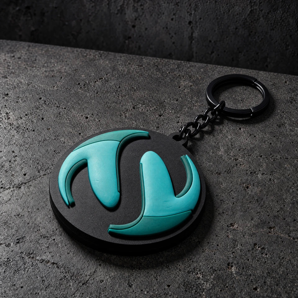 custom 3d domed soft pvc keyrings on a charcoal studio surface — Projectprint