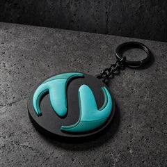 custom 3d domed soft pvc keyrings on a charcoal studio surface — Projectprint