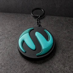 teal sculpted pvc full keyring on a charcoal studio surface — Projectprint