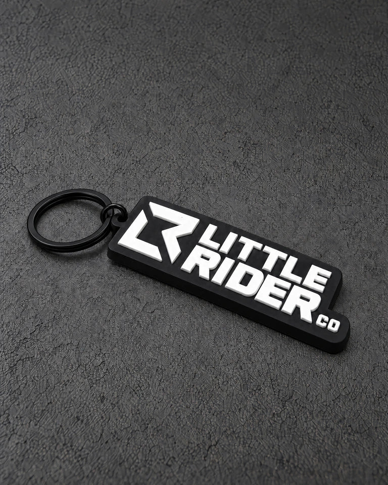 little rider black white keyring on a charcoal studio surface — Projectprint
