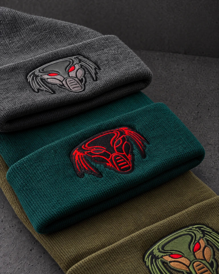 embroidered emblem colourways detail on a charcoal studio surface — Projectprint