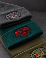 embroidered emblem colourways detail on a charcoal studio surface — Projectprint