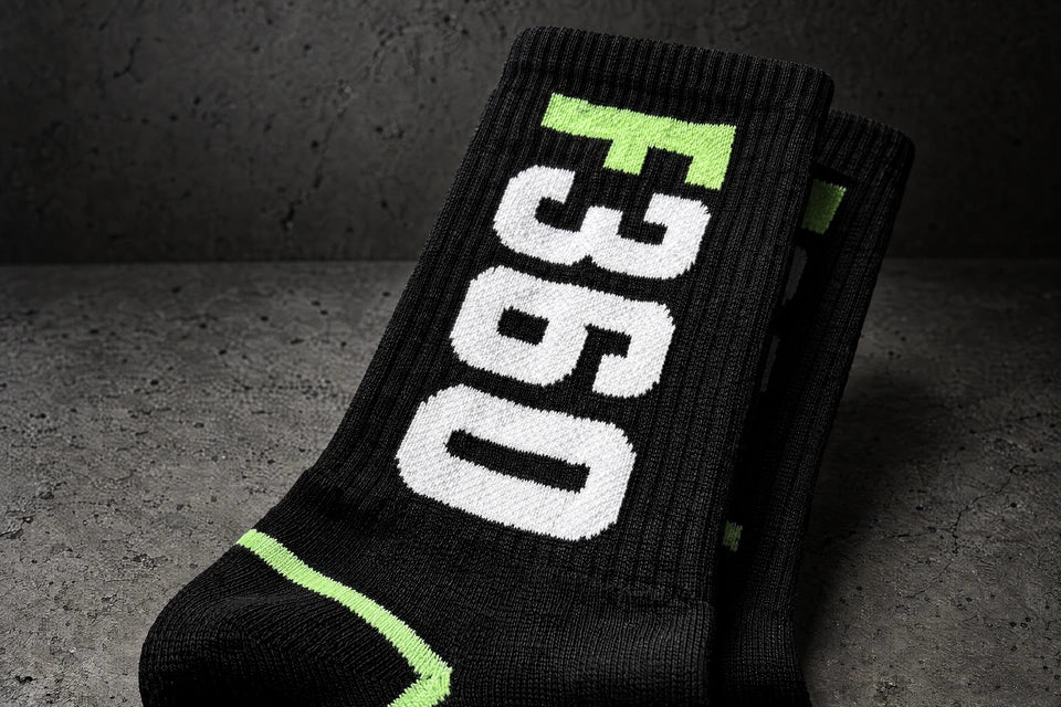 jacquard knit socks on a charcoal studio surface — Projectprint