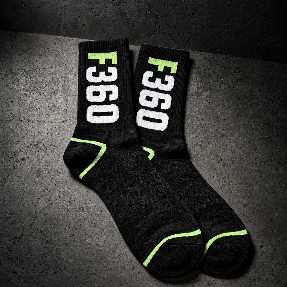 jacquard knit socks on a charcoal studio surface — Projectprint