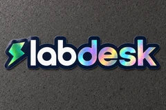 Projectprint holographic die cut sticker — labdesk wordmark, studio product view