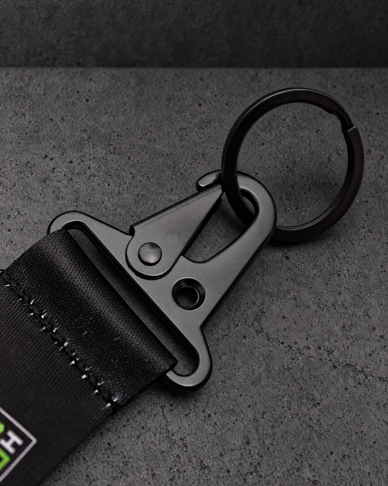 black trigger clasp detail on a charcoal studio surface — Projectprint