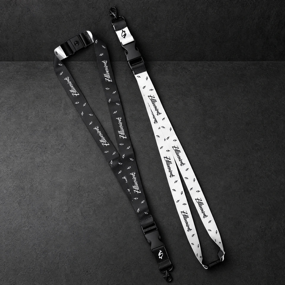zillionaire printed lanyard pair on a charcoal studio surface — Projectprint