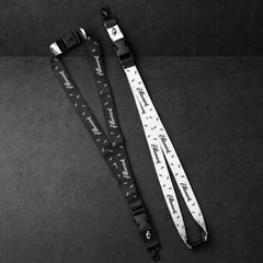 zillionaire printed lanyard pair on a charcoal studio surface — Projectprint