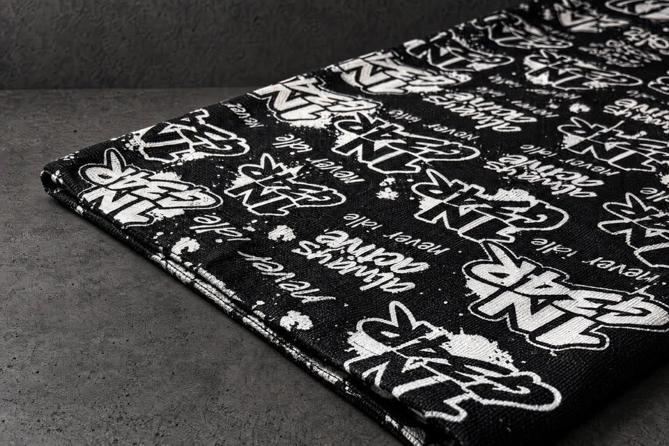1ngear fabric edge print detail on a charcoal studio surface — Projectprint