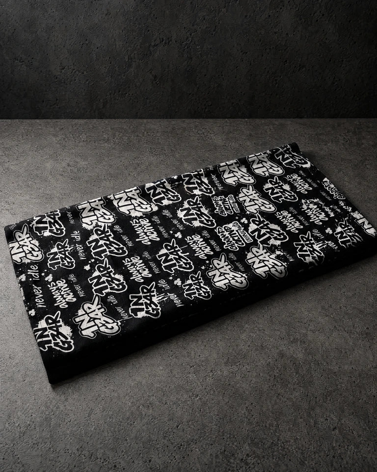 1ngear folded snood on a charcoal studio surface — Projectprint
