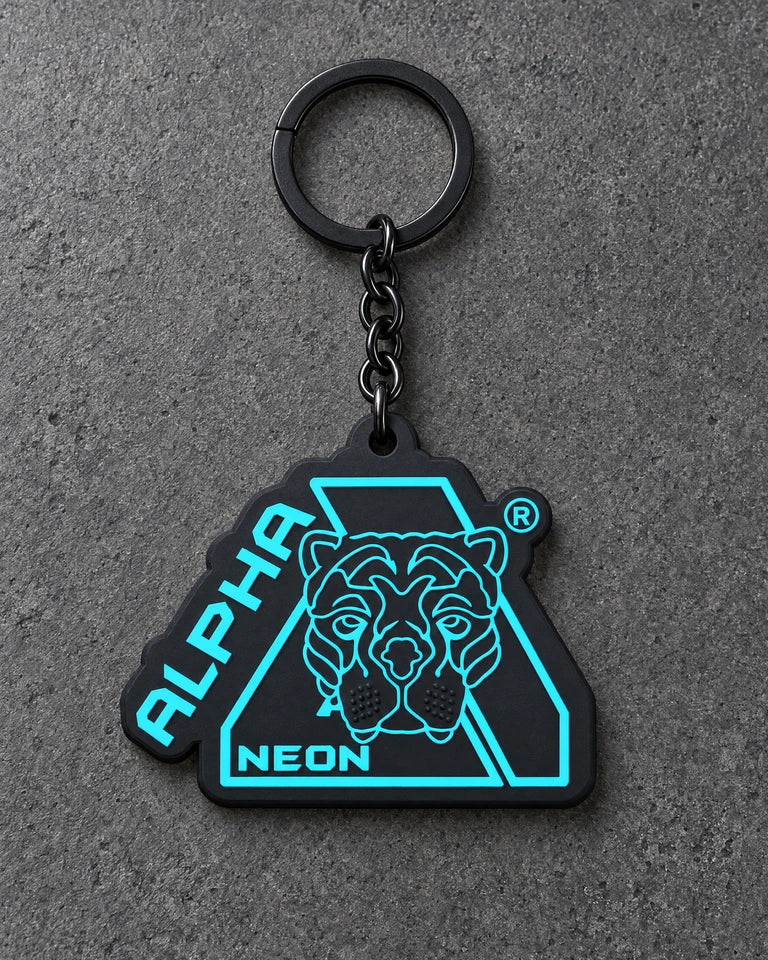 Projectprint custom soft PVC keyring — alpha neon, charcoal studio product photograph