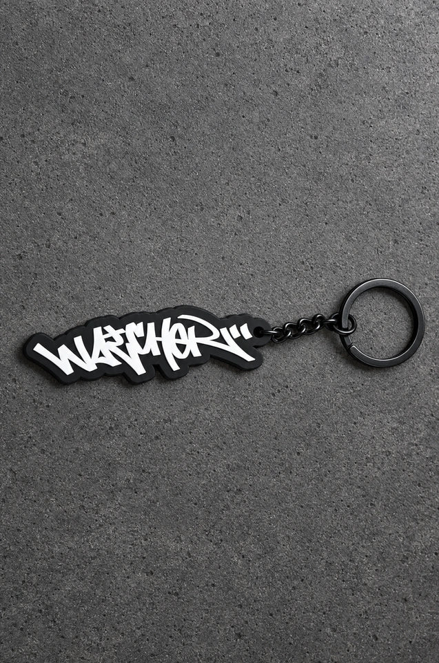 Projectprint custom soft PVC keyring — graffiti wordmark, charcoal studio product photograph