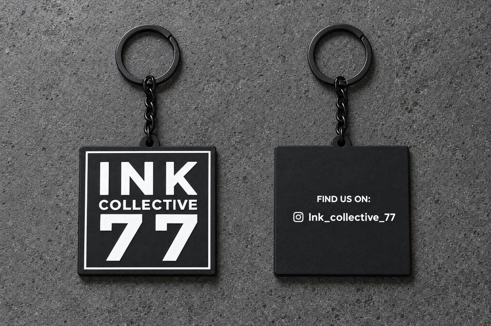 Projectprint custom soft PVC keyring — ink collective 77 front back, charcoal studio product photograph