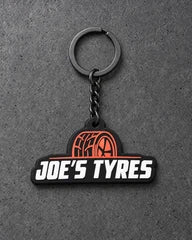 Projectprint custom soft PVC keyring — joes tyres, charcoal studio product photograph
