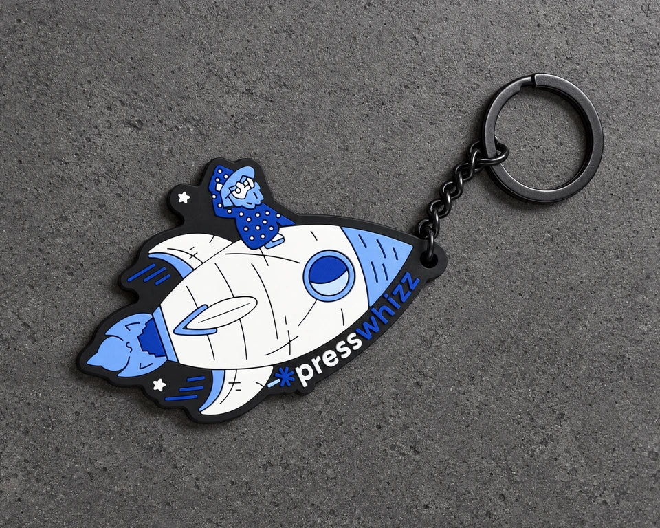 Projectprint custom soft PVC keyring — presswhizz rocket, charcoal studio product photograph